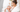 Young mother breastfeeding her baby, illustrating essential breastfeeding must haves for new moms.