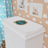 Baby Changing Pad Cover featuring floral design and text 'Just This Moment' on a dresser in a nursery.