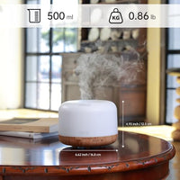 ASAKUKI Fertility Essential Oil Diffuser on a table, releasing calming mist during the TTC and IVF process.