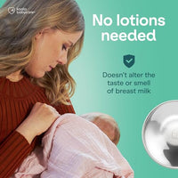 Mother breastfeeding her baby, with a note that silver cups need no lotions and do not alter the taste or smell of breast milk