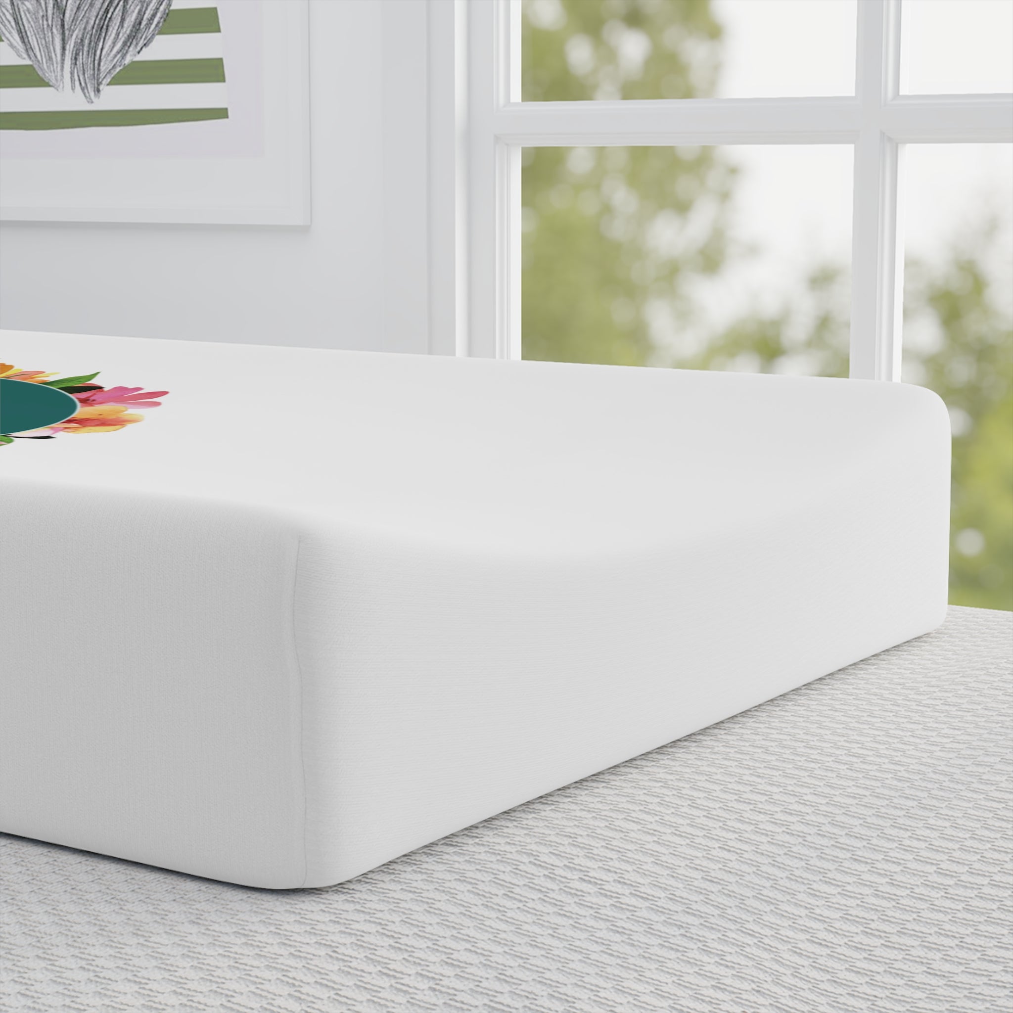 Baby Changing Pad Cover featuring vibrant floral design on a soft, white surface in a calming indoor setting.