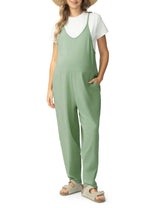 Maternity jumpsuit in soft green with pockets, perfect for comfortable pregnancy wear.