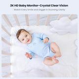 Baby in a crib showcasing the crystal-clear vision of a 2K HD baby monitor.