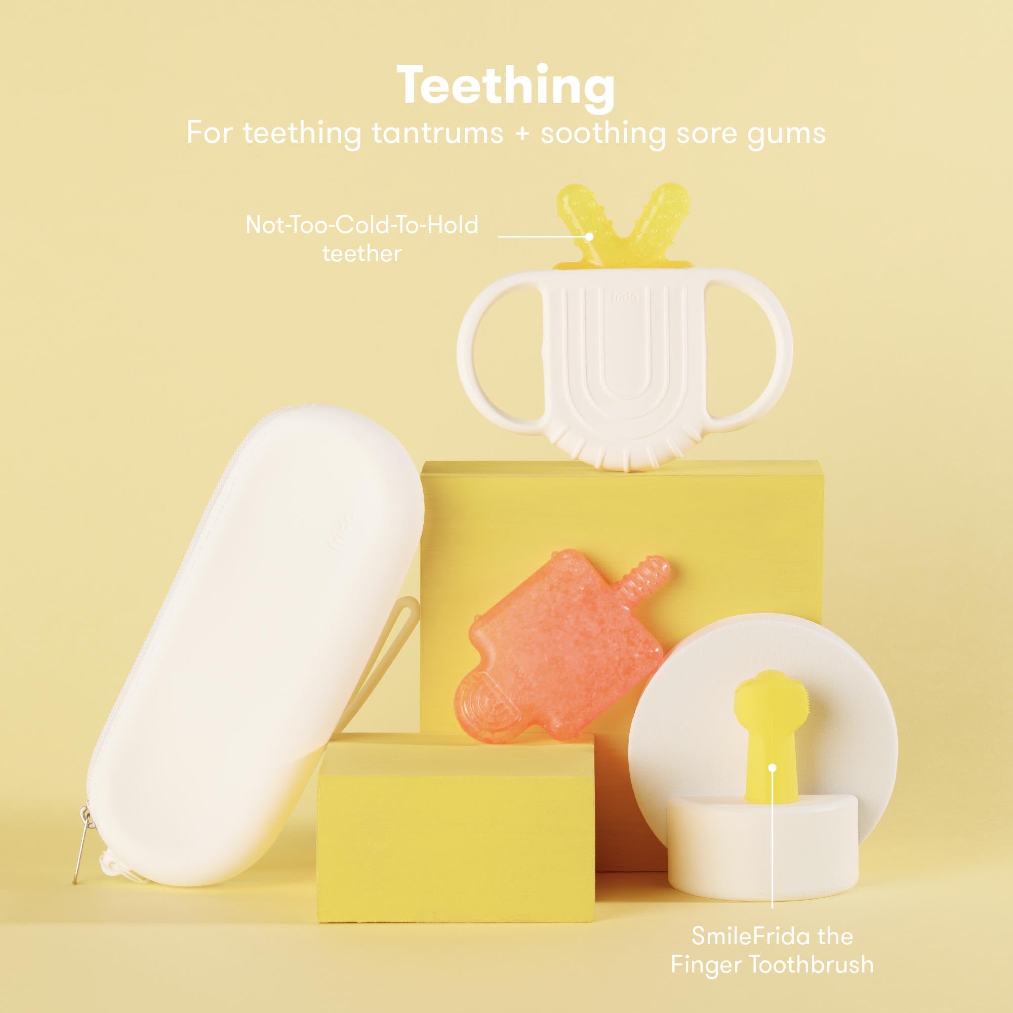 Teething product display featuring SmileFrida Finger Toothbrush and teething toys for soothing sore gums, part of a baby grooming kit