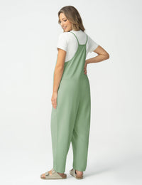 Maternity jumpsuit in green, featuring a relaxed fit and adjustable straps, perfect for comfort during pregnancy.