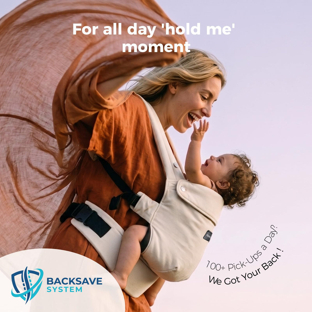 Smiling mother playing with her baby in the Momcozy PureHug carrier outdoors
