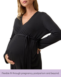 Pregnant woman wearing the black maternity nursing robe with the tie fastened high above her bump