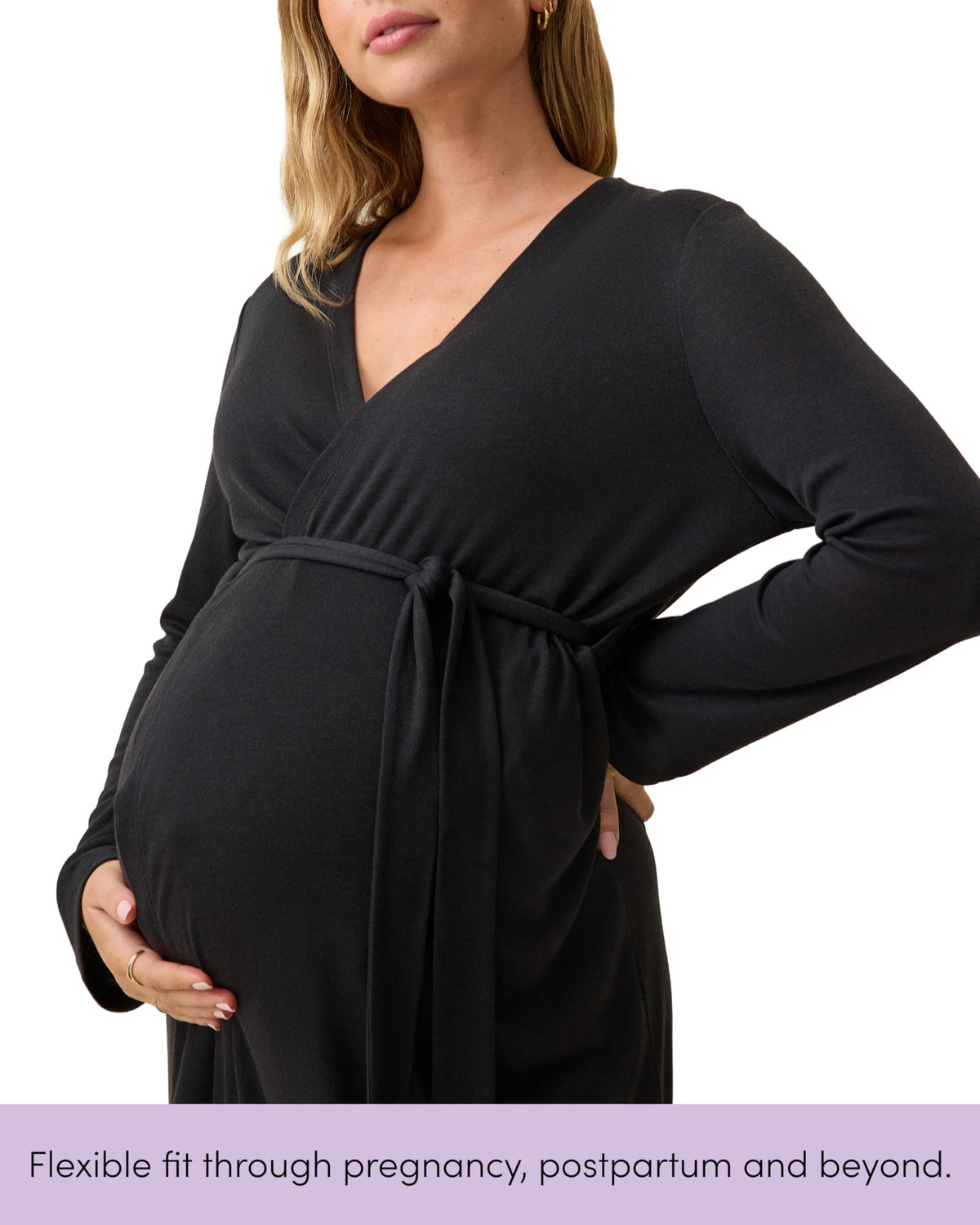 Pregnant woman wearing the black maternity nursing robe with the tie fastened high above her bump