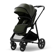 Convertible bassinet stroller in stylish green design, perfect for newborns and growing babies.