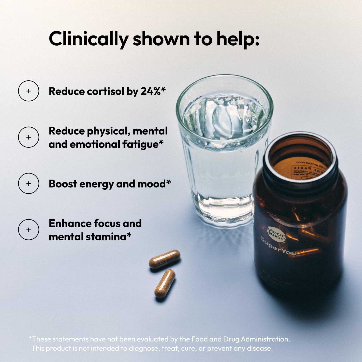 Stress relief supplements for women including Moon Juice SuperYou capsules with a glass of water.