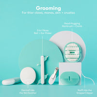 Image of a Baby Grooming Kit including head-hugging hairbrush, ear picker, and nail clipper for newborn care.