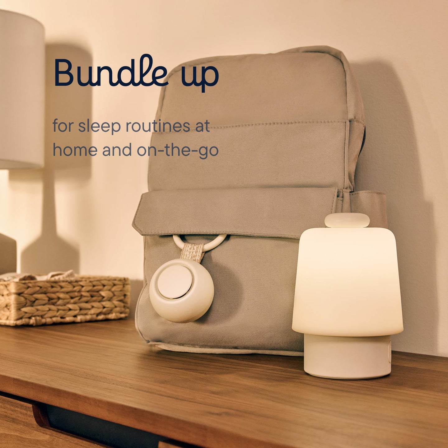 Bundle up portable sound machine for baby on a bedside table, perfect for sleep routines at home and while traveling.