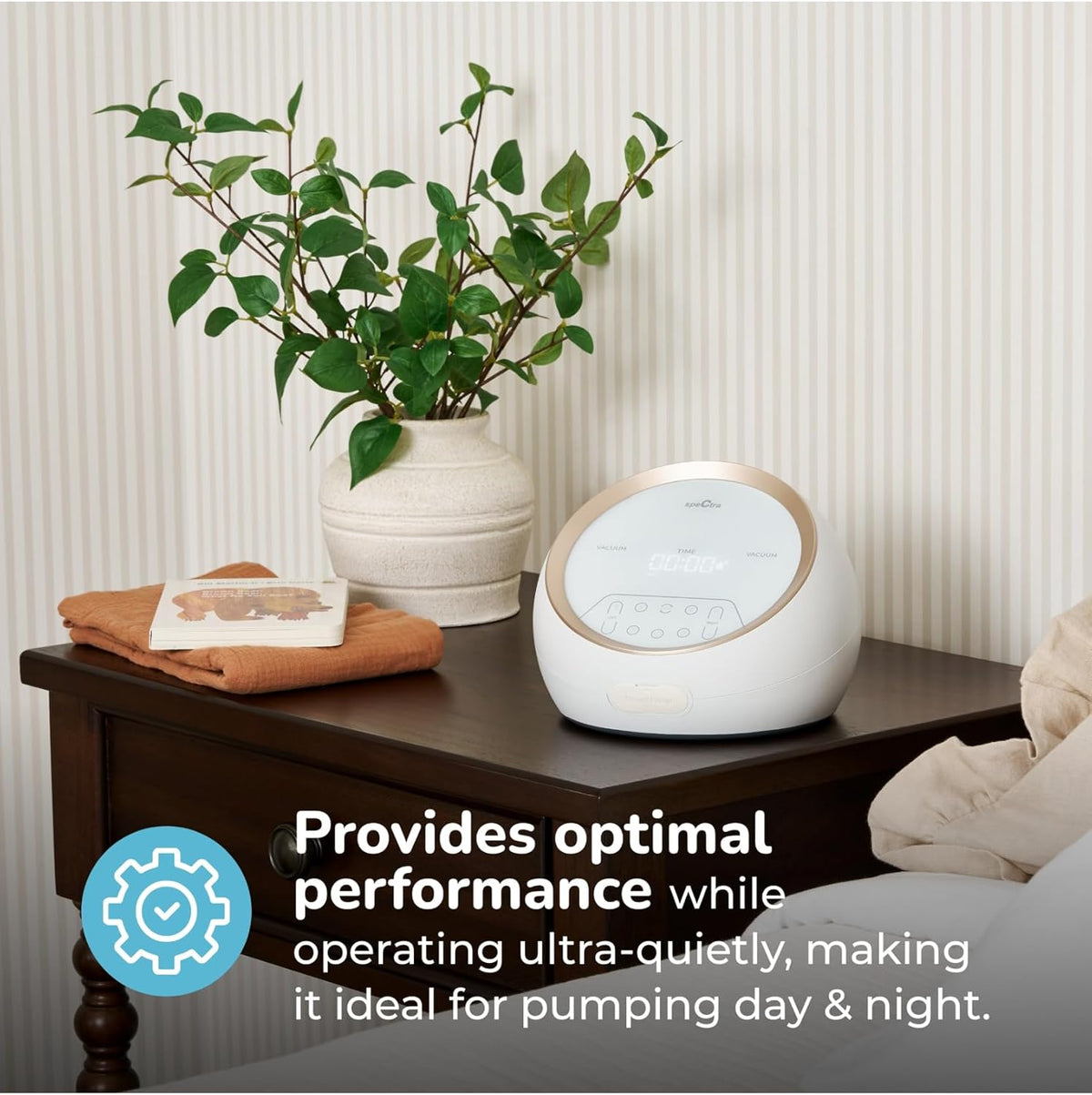 Spectra Synergy Gold dual motor breast pump on a bedside table