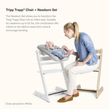 Stokke Tripp Trapp baby high chair with newborn set, designed for bonding and comfort, suitable for infants up to 20 lbs.