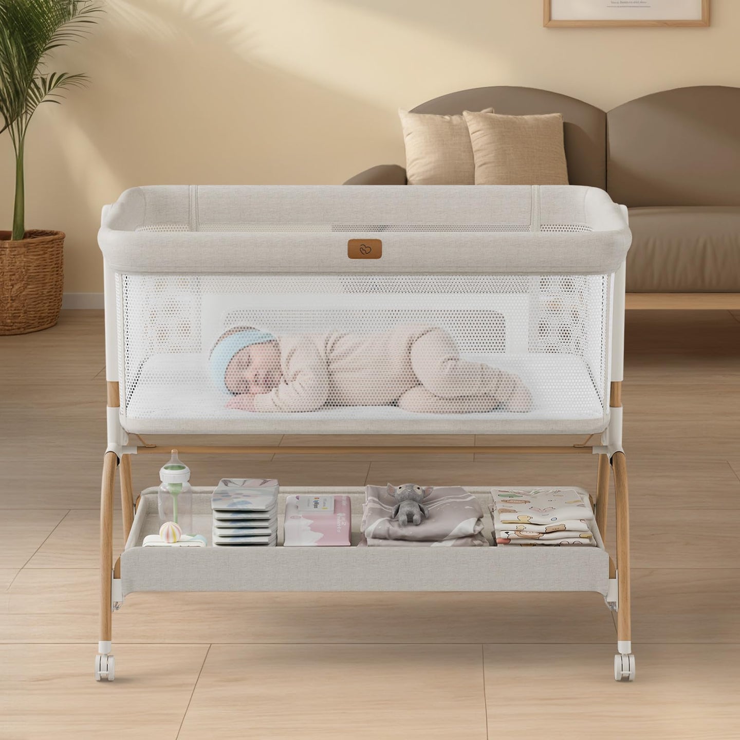 BabyBond 3-in-1 bedside bassinet with newborn sleeping soundly in a cozy, safe space.