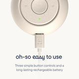 Close-up of the Hatch Go Portable Sound Machine for baby, showcasing three button controls and a charging port.