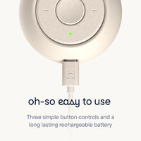 Close-up of the Hatch Go Portable Sound Machine for baby, showcasing three button controls and a charging port.