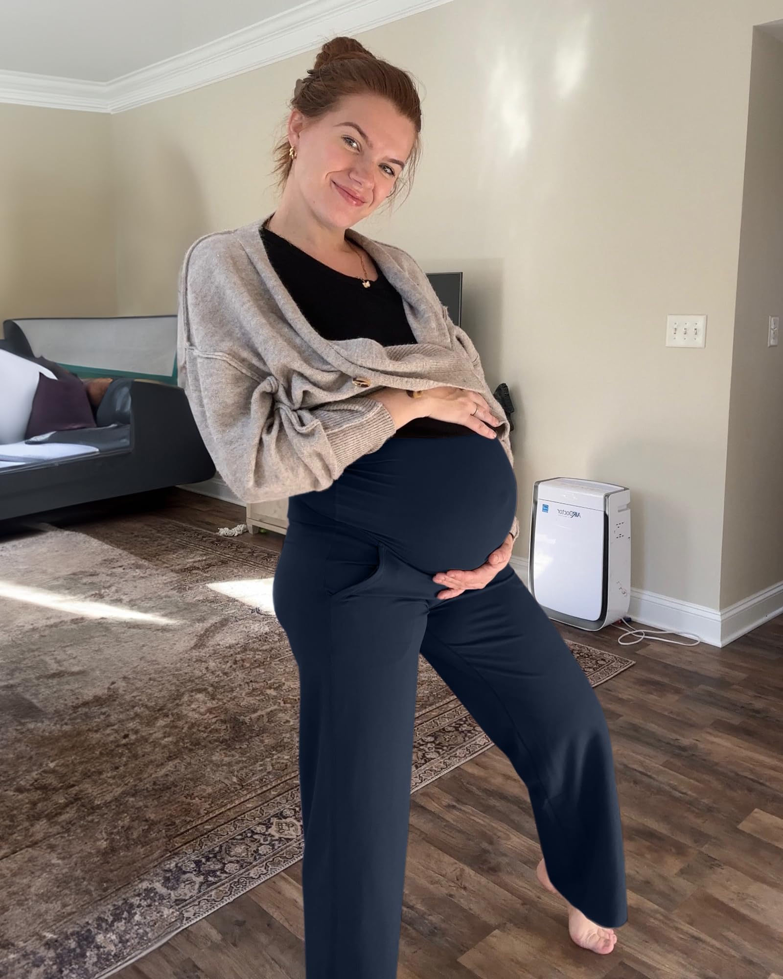 A pregnant woman wearing G4Free maternity leggings, showcasing comfort and style with an over-belly panel.