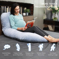 Pregnancy pillow for sleeping providing full-body support for expectant moms while reading in bed.