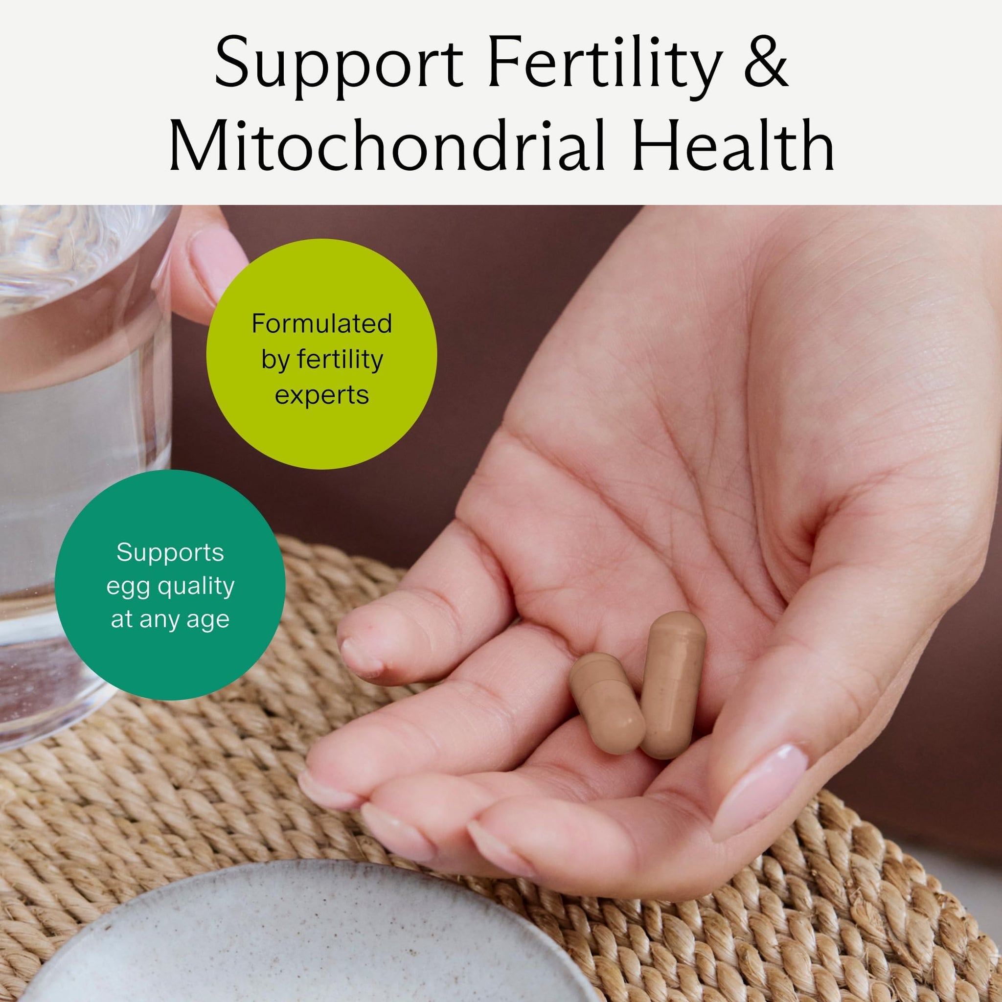 Egg quality supplement for fertility displayed in a hand with a glass of water, promoting egg health and mitochondrial support.