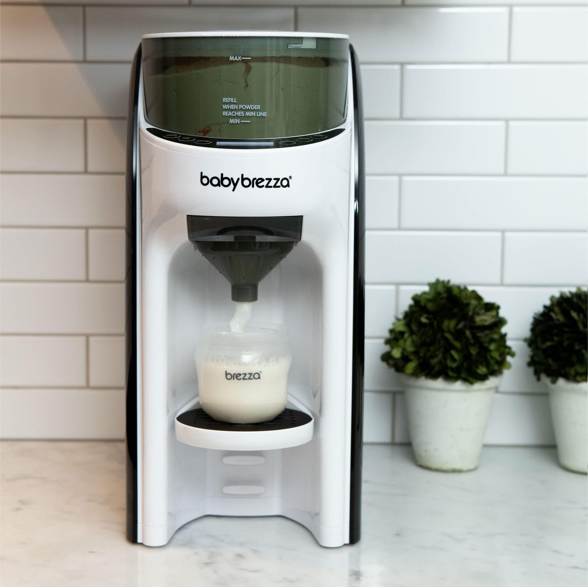 Automatic Formula Dispenser for Newborns — Baby Brezza Pro Advanced measuring and dispensing formula.