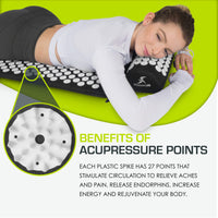 Woman using the ProSource acupressure mat and pillow for stress relief and circulation benefits.
