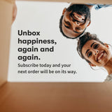 Two happy people looking inside a box with text 'Unbox happiness, again and again. Subscribe today and your next order will be on its way.'