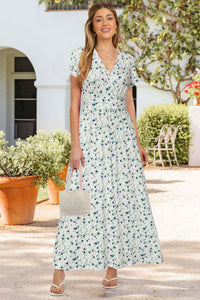 Maternity maxi dress featuring a floral print, designed for pregnancy comfort and style for baby showers and photoshoots.