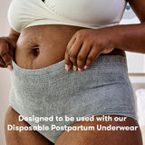 Person wearing grey postpartum underwear designed for use with postpartum pads for added comfort and protection.