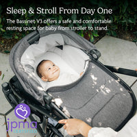 Newborn lying flat in the UPPAbaby Bassinet V3 on a stroller frame, suitable for use from day one