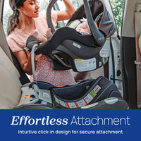 A woman using the Chicco KeyFit 30 infant car seat with effortless attachment design for secure installation.