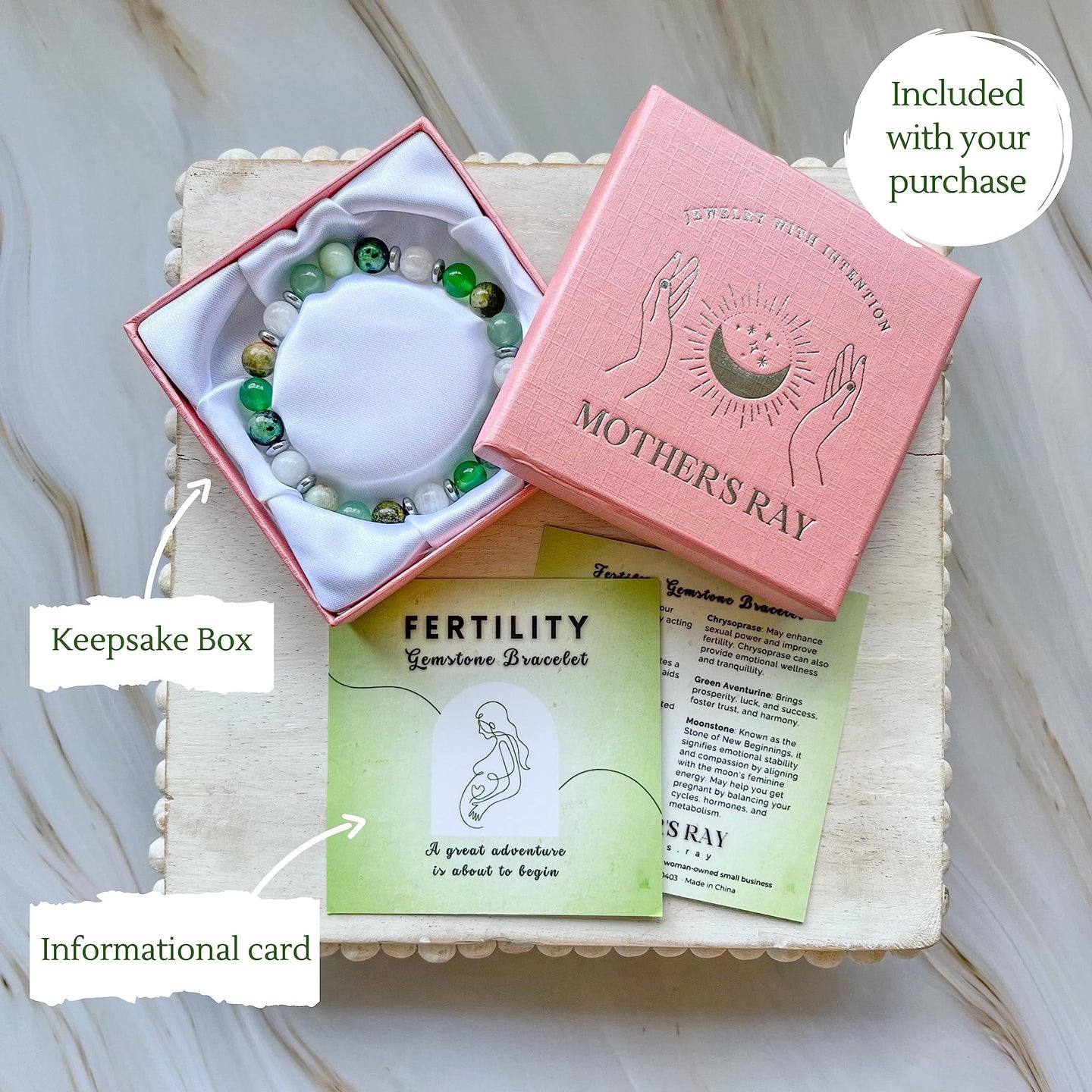 Fertility crystal bracelet with keepsake box and informational card, part of Mother’s Ray collection.
